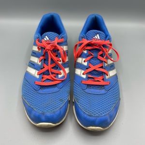 Adidas blue shoes with orange laces